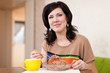  woman eats buckwheat porridge