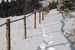 Wooden fence in the mountains at winter