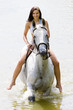 Photo: equestrian on horseback riding through water equestrian on horseback riding through water