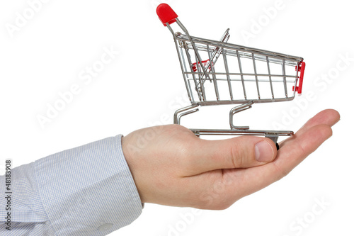 Photo: Hand holding shopping cart Hand holding shopping cart
