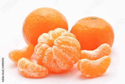 Photo: Orange tangerines isolated on a white Orange tangerines isolated on a white