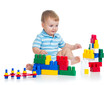 little cheerful child with construction set over white backgroun