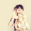 Fashion portrait of a beautiful young woman wearing sunglasses