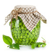 green peas in glass jar isolated on white background