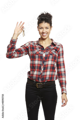 Photo: Young woman holding set of house keys Young woman holding set of house keys