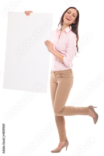 Photo: Beautiful woman holding blank board Beautiful woman holding blank board