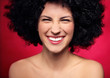 Woman with black afro hairstyle smiling
