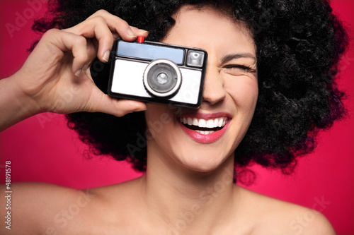 Photo: Woman with vintage camera Woman with vintage camera