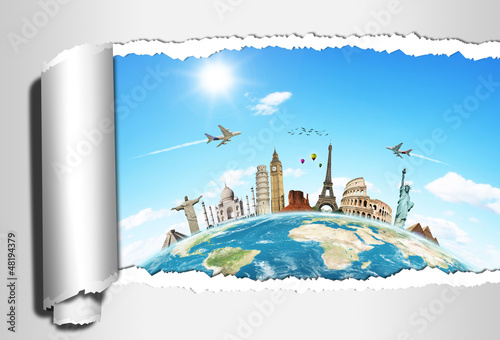 Photo: Travel the world concept torned paper monument Travel the world concept torned paper monument
