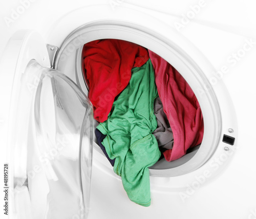 Photo: Washing machine with clean colorful clothes Washing machine with clean colorful clothes