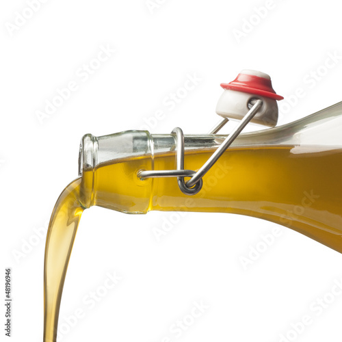 Photo: Pouring olive oil with a bottle Pouring olive oil with a bottle
