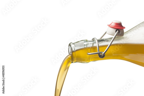 Photo: Pouring olive oil with a bottle Pouring olive oil with a bottle