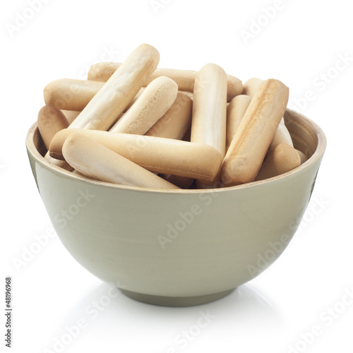 Photo: Bread sticks bowl isolated on white Bread sticks bowl isolated on white
