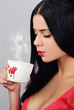 lovely lady behind a mug of warm drink