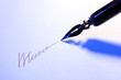 Closeup of signature (fake, not real) and ink pen, isolated