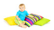 Little boy and color pillows, isolated on white