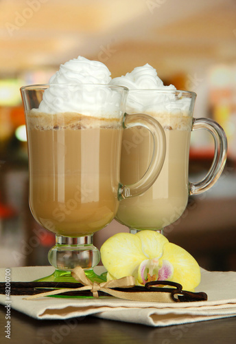 Photo: Fragrant coffee latte in glasses cups with vanilla pods, Fragrant coffee latte in glasses cups with vanilla pods,