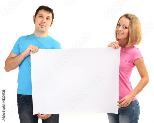 Photo: Young couple holding blank poster isolated on white Young couple holding blank poster isolated on white
