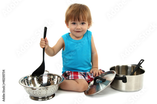 Photo: cute little boy with kitchen accessories, isolated on white cute little boy with kitchen accessories, isolated on white