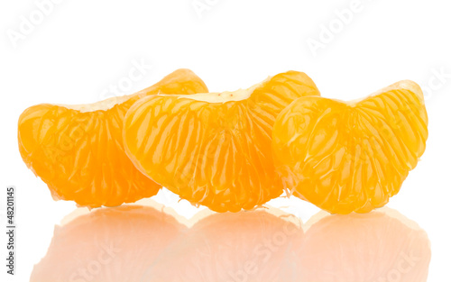 Photo: Ripe sweet tangerine cloves, isolated on white Ripe sweet tangerine cloves, isolated on white