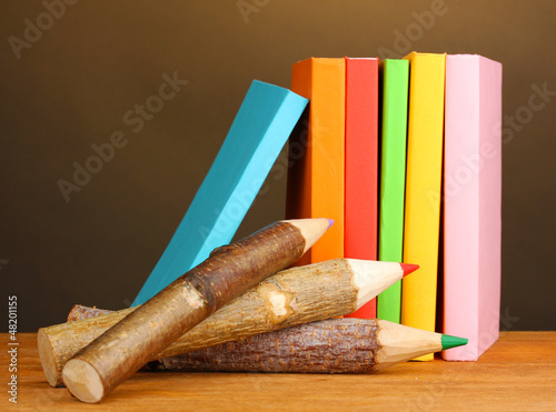Photo: Colorful wooden pencils with books Colorful wooden pencils with books