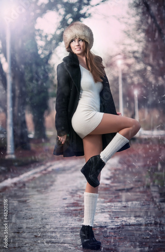 Photo: beauty young woman in a winter fashion shot.Winter wild woman beauty young woman in a winter fashion shot.Winter wild woman
