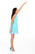 tall young woman reaching for something high