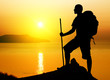 tourist on sundown background.