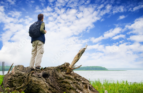 Photo: The tourist looking in a distance The tourist looking in a distance