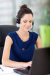 beautiful young online support operator working on laptop