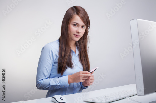 Photo: Woman polish nails at office Woman polish nails at office