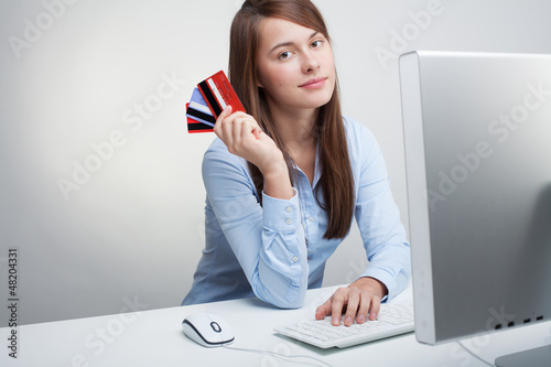 Photo: Woman holding credit cards Woman holding credit cards