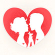 silhouettes of lovers on a background of red hearts