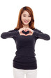Beautiful Asian casual woman show heart shape.