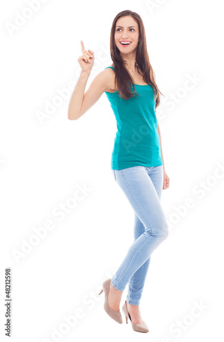 Photo: Young woman pointing up Young woman pointing up