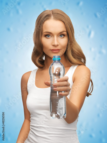 Photo: young beautiful woman with bottle of water young beautiful woman with bottle of water