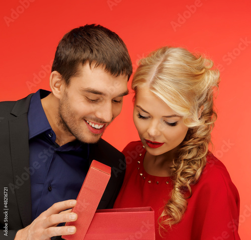 Photo: man and woman looking inside the gift box man and woman looking inside the gift box