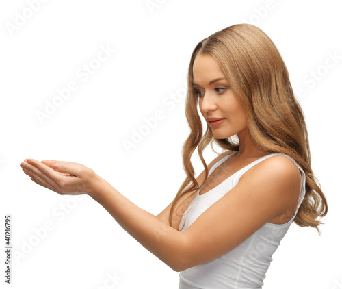 Photo: woman holding something on the palms woman holding something on the palms