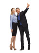 man and woman pointing their fingers