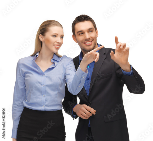 Photo: man and woman working with something imaginary man and woman working with something imaginary