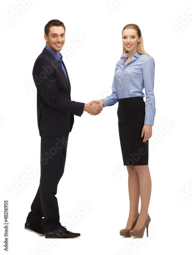 Photo: man and woman shaking their hands man and woman shaking their hands