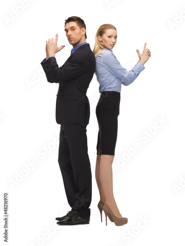 Photo: man and woman making a gun gesture man and woman making a gun gesture