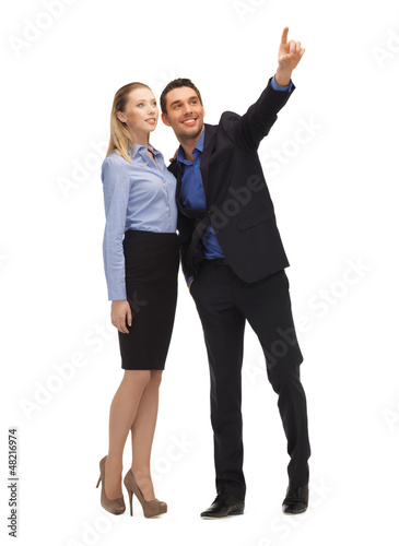 Photo: man and woman pointing their fingers man and woman pointing their fingers