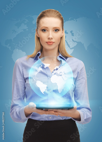 Photo: woman with tablet pc and virtual earth woman with tablet pc and virtual earth