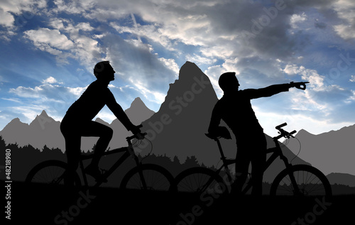 Illustration: silhouette cyclists in sunset silhouette cyclists in sunset