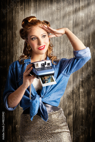 Photo: Young Retro Woman Holding Instant Camera Young Retro Woman Holding Instant Camera