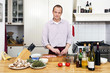Photo: Man Preparing Meat At Kitchen Counter Man Preparing Meat At Kitchen Counter