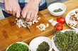 Photo: Closeup Of Man Chopping Mushrooms Closeup Of Man Chopping Mushrooms