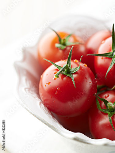 Photo: Close up of cherry tomatoes in a bowl Close up of cherry tomatoes in a bowl