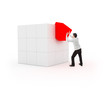 Photo: Young man placing a cube for completion Young man placing a cube for completion